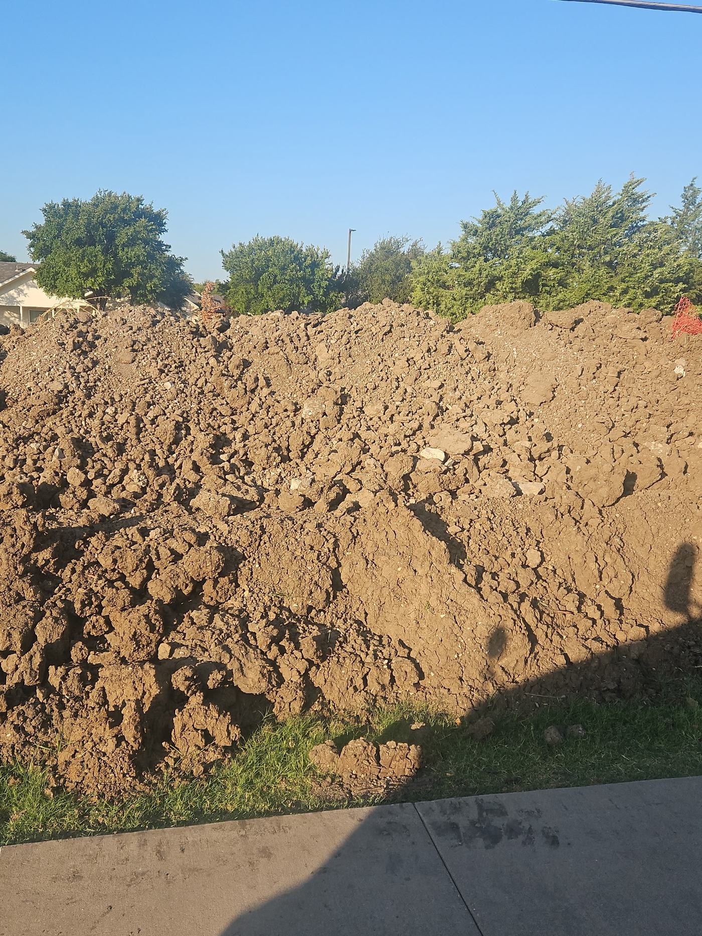A real pile of fill dirt delivered to a residential property